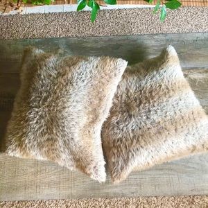 A Pair of Large Faux Wolf Fur Pillows